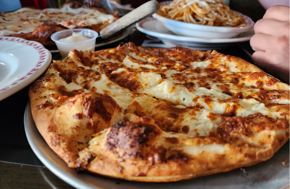 Fresh cheese pizza and pasta served at Vito's in Uptown Saint John, perfect for a March Break lunch outing.