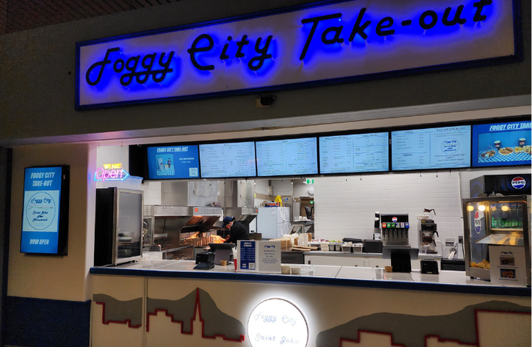Foggy City Takeout inside Brunswick Square, Uptown Saint John — bright counter with friendly staff serving Maritime comfort food and quick lunch options.