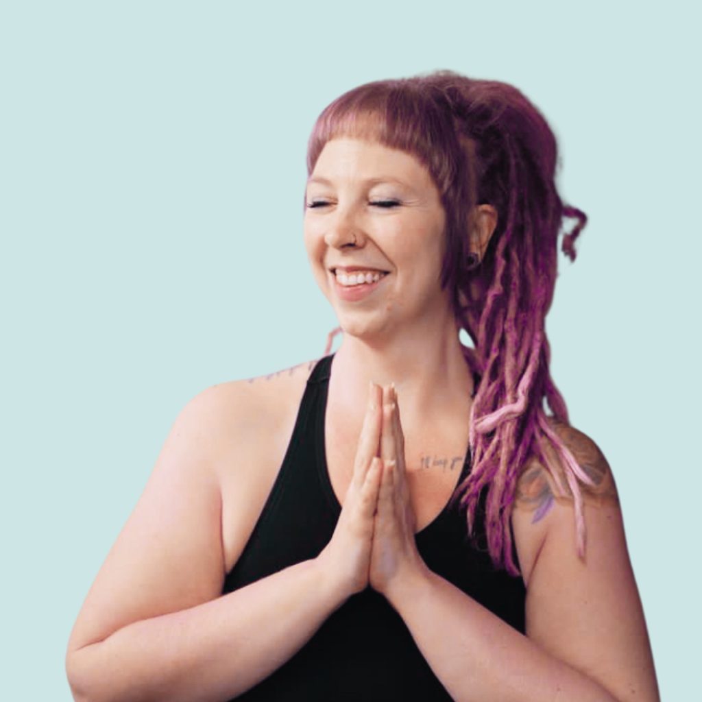 A yoga practitioner practices an embodied pose outdoors in natural light, reflecting Cove Yoga’s focus on presence, ritual, and mindful movement.