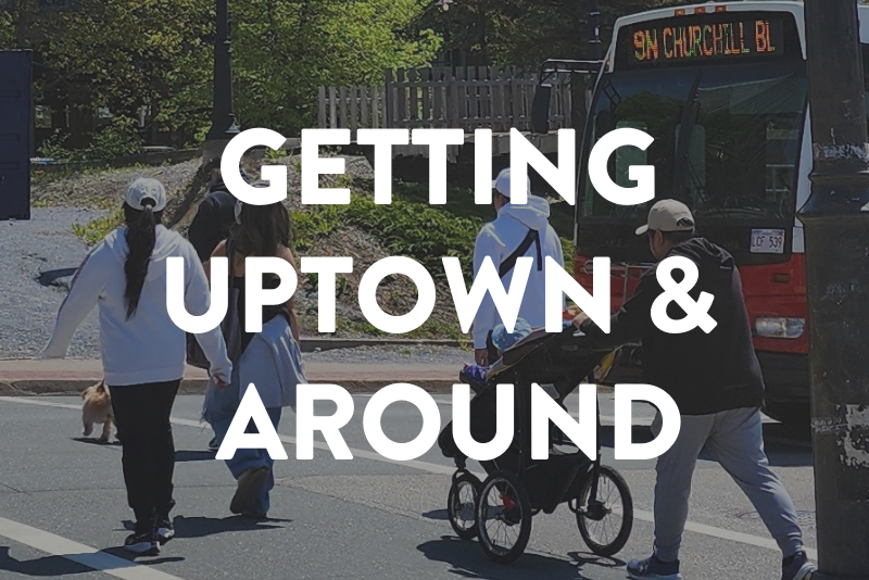 People crossing a street in Uptown Saint John near a city bus, showing how visitors can walk, use transit, and explore the area.